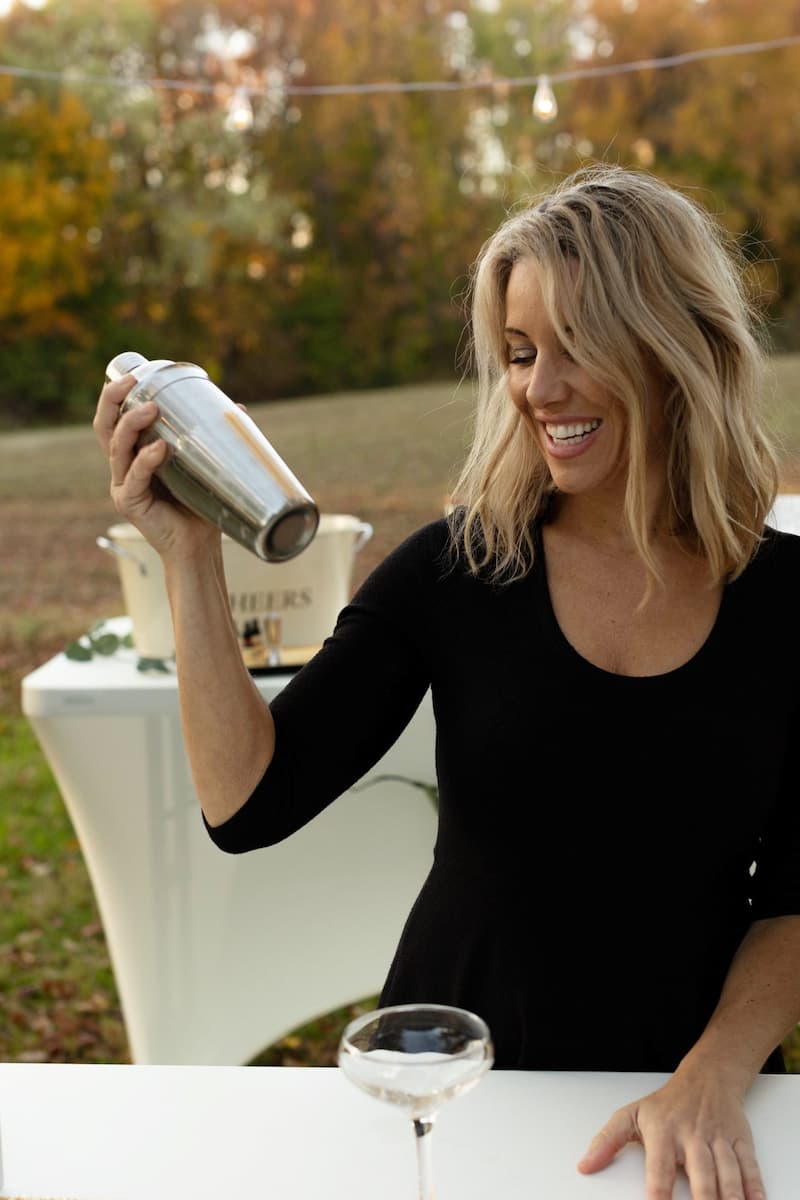 Chesapeake Bartenders owner shaking a signature cocktail at a wedding event