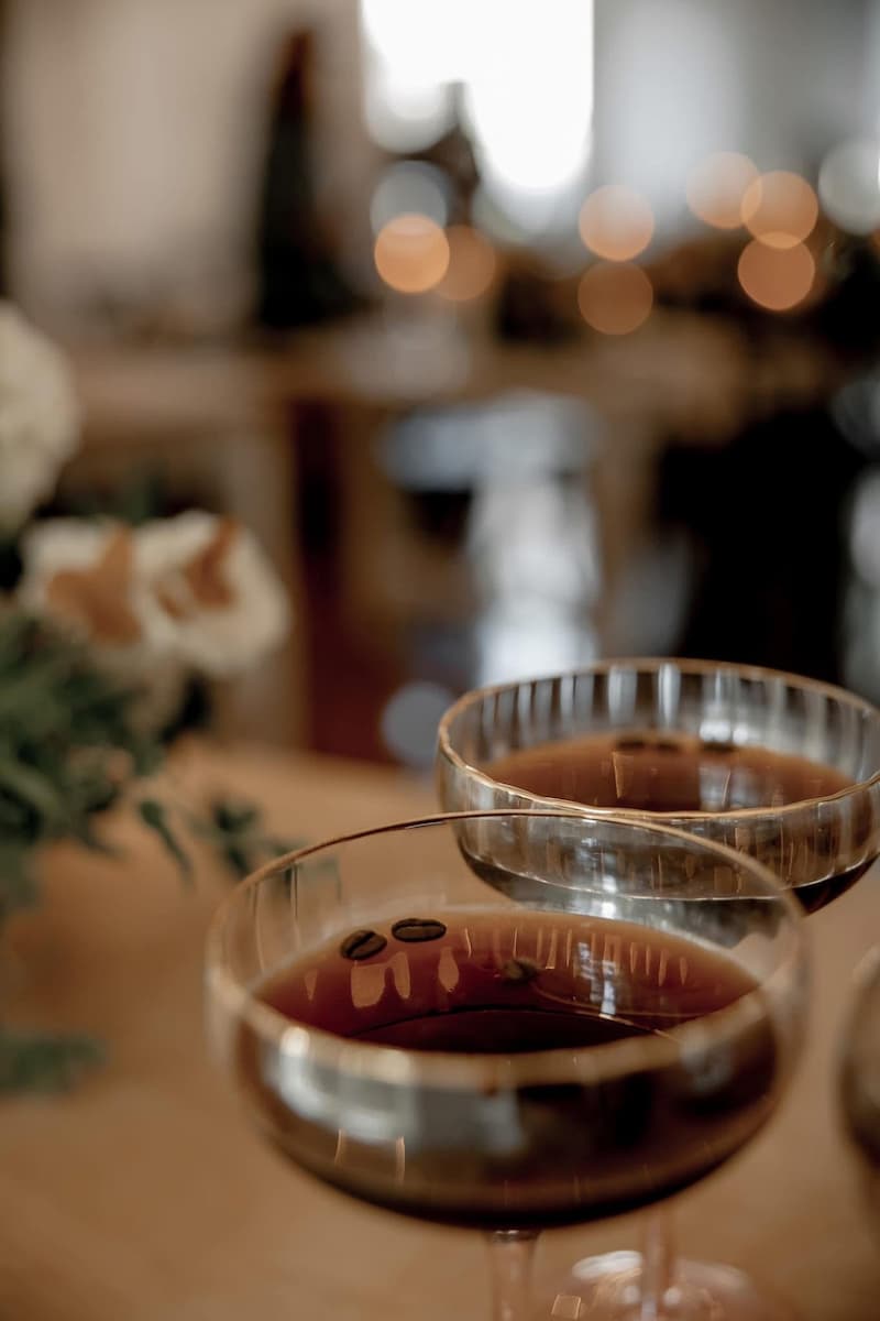 Bartender pouring an espresso martini signature cocktail at wedding bar