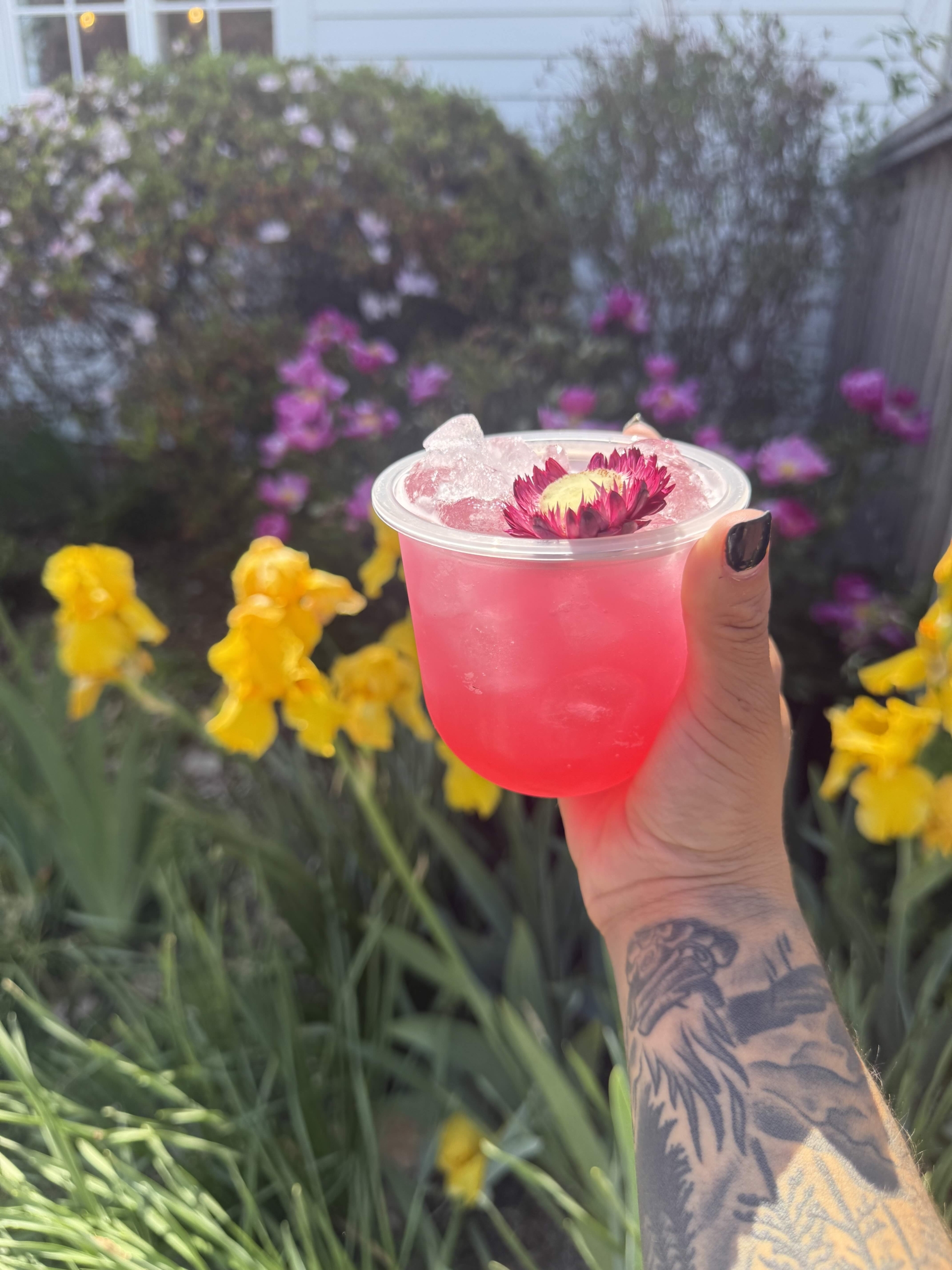 Dragonfruit hibiscus and citrus signature cocktails crafted by Chesapeake Bartenders and Events at a Hawaiian inspired engagement party in Maryland