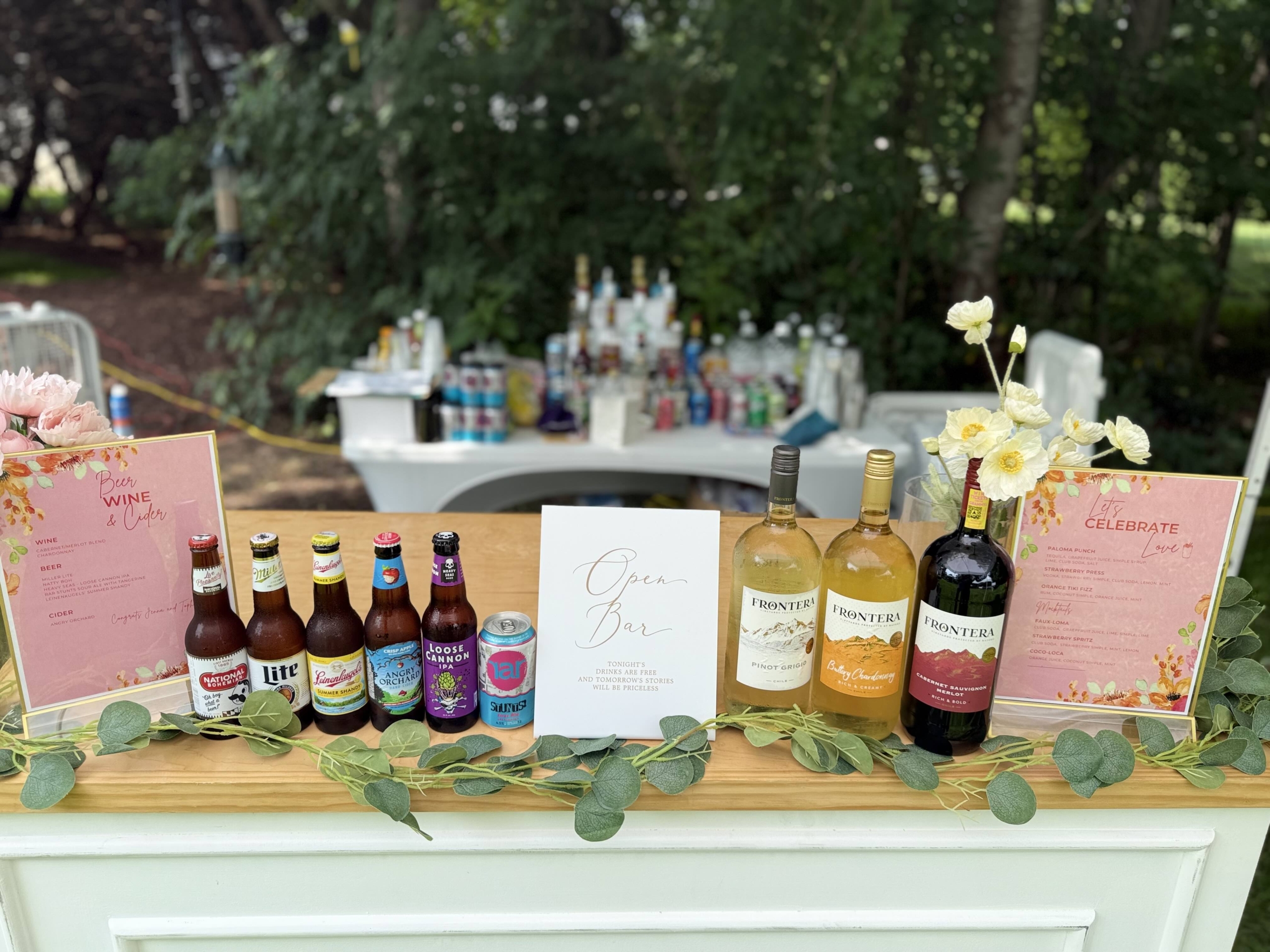 Front bar and back bar setup at a real wedding showing the two-table system