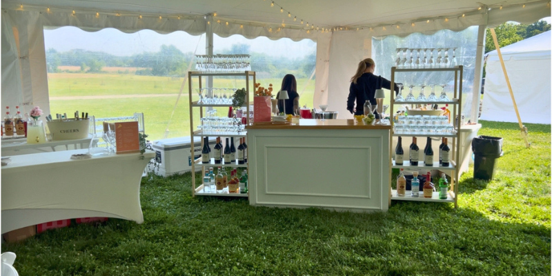 CBE bartenders finishing setup details at Hepburn Bar ahead of cocktail hour at Stepne Manor